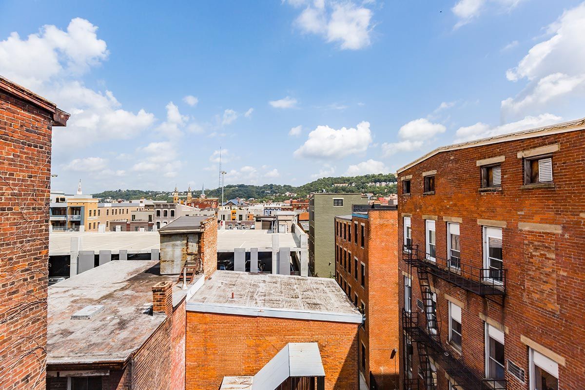 A view of a city from the roof of a building.