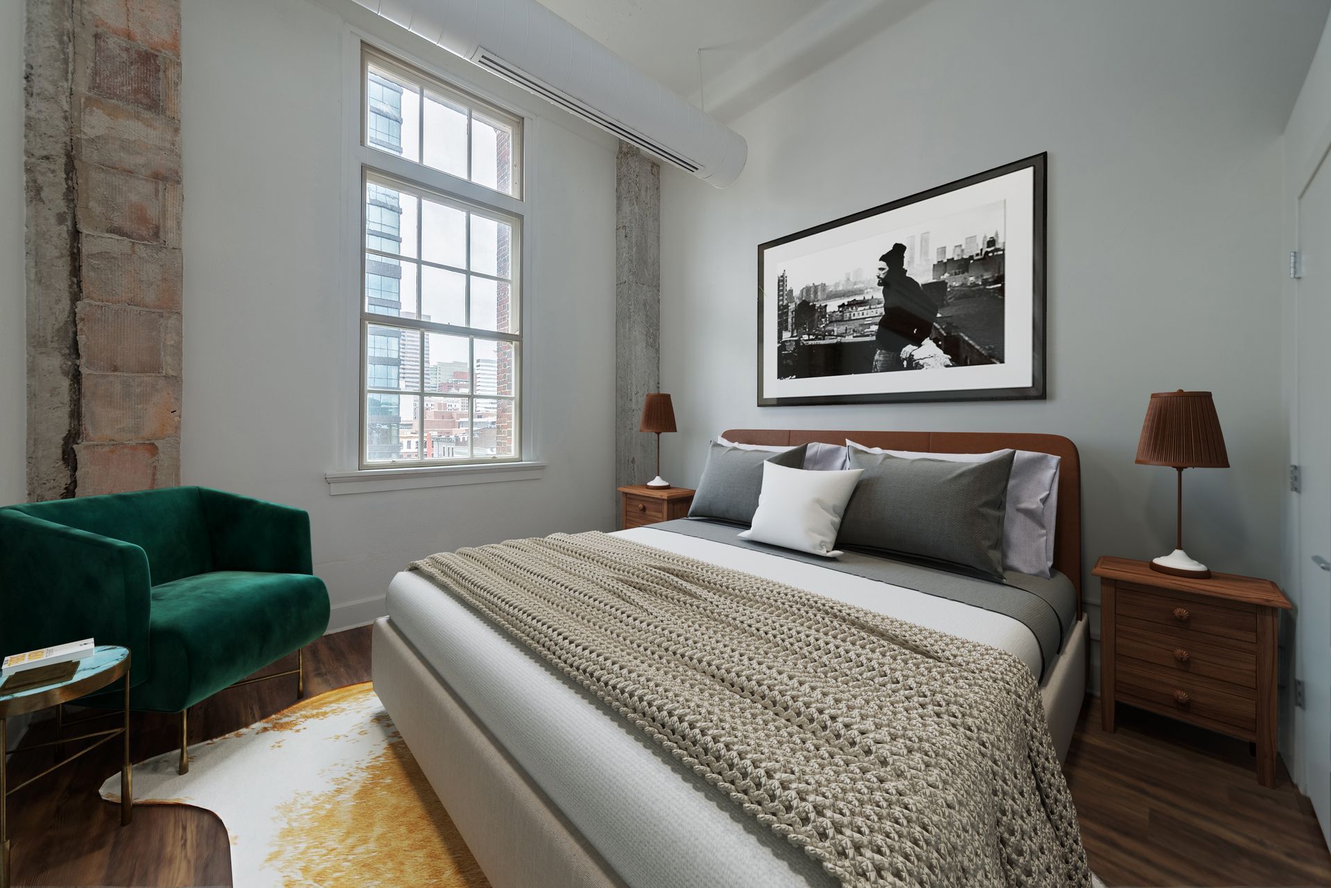 A bedroom with a large bed and a green chair