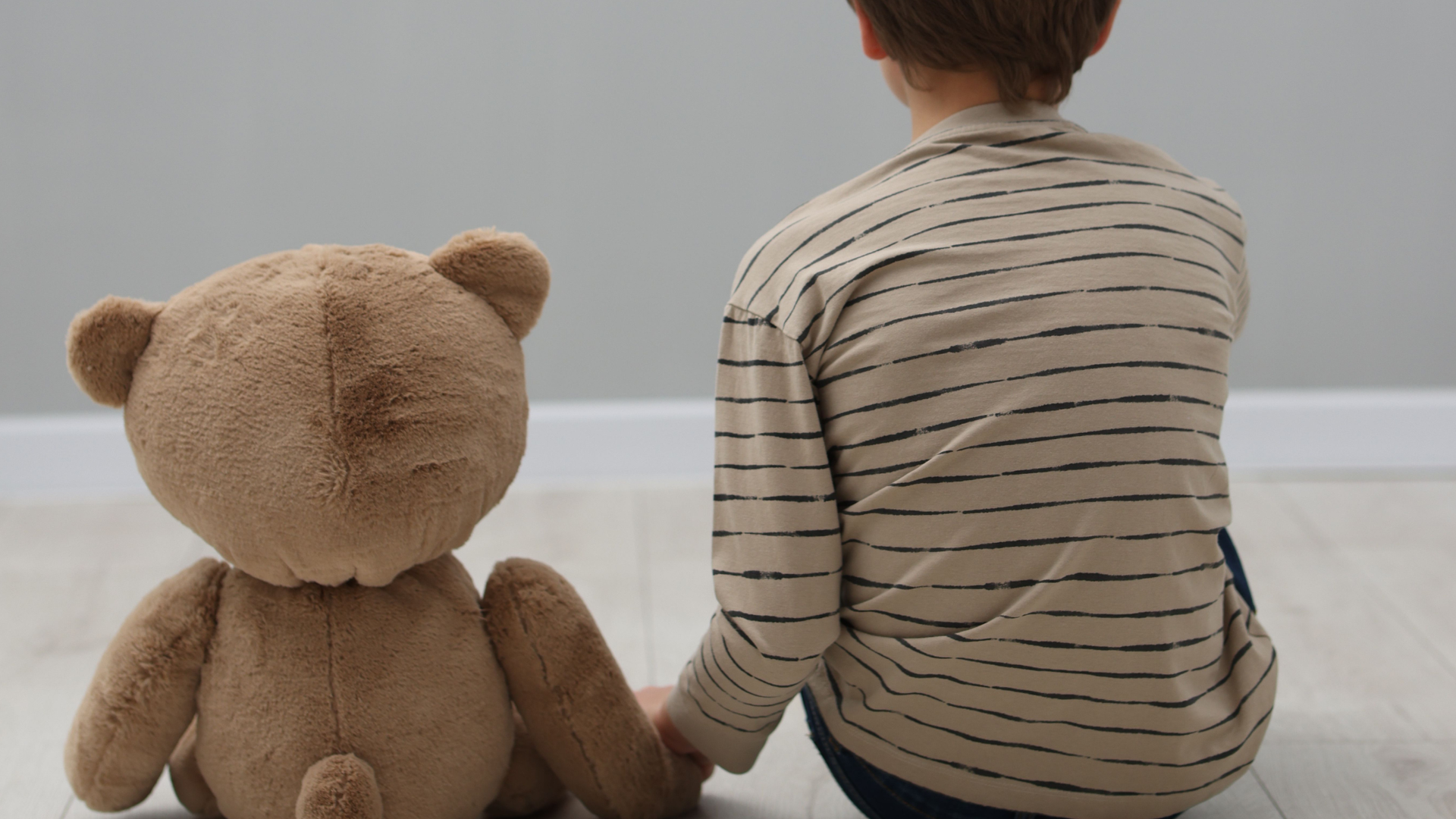 Child hugging parent