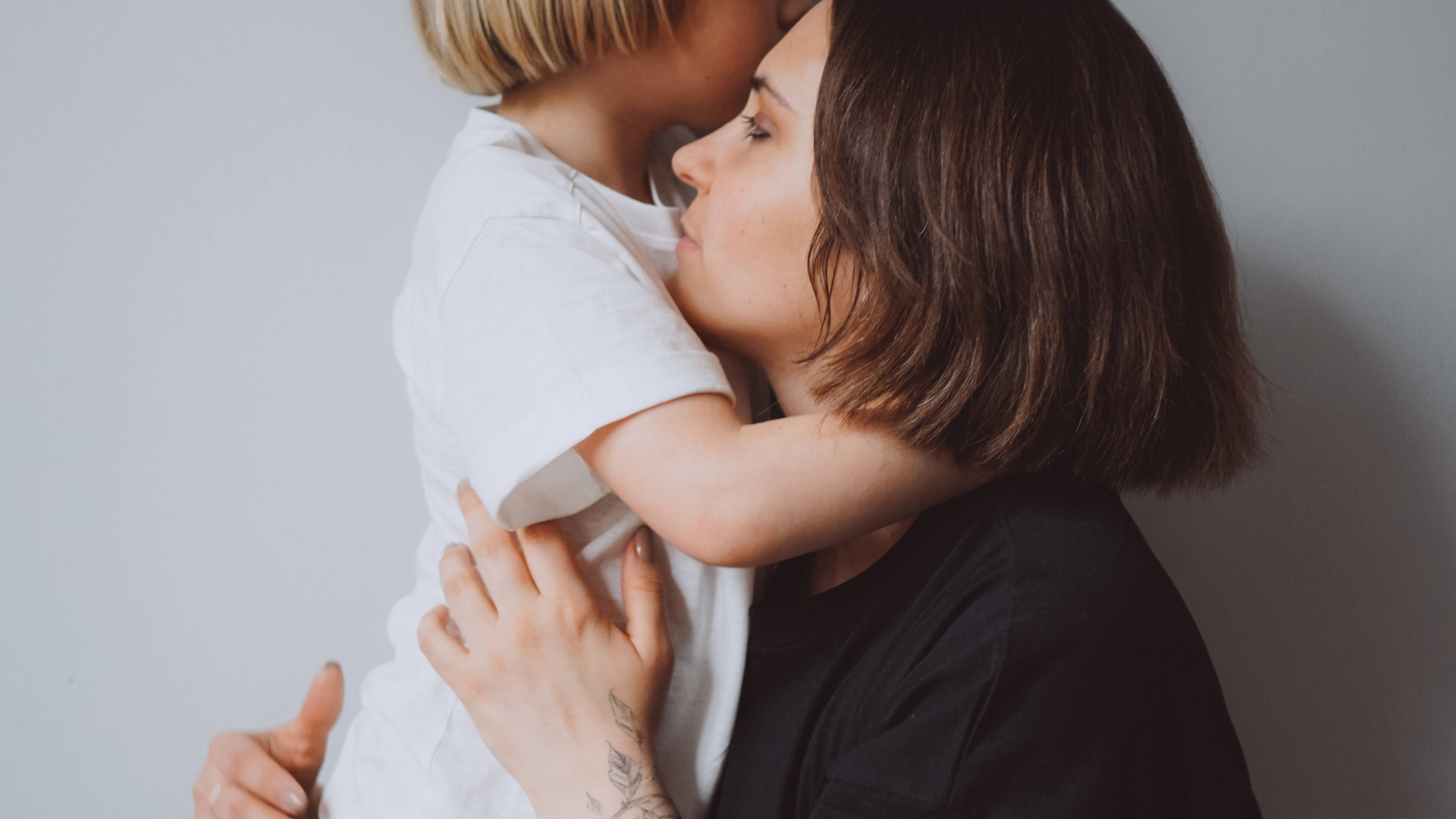 Mum and child hugging