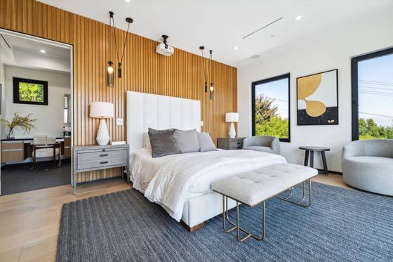There is a large bed in the middle of the room.