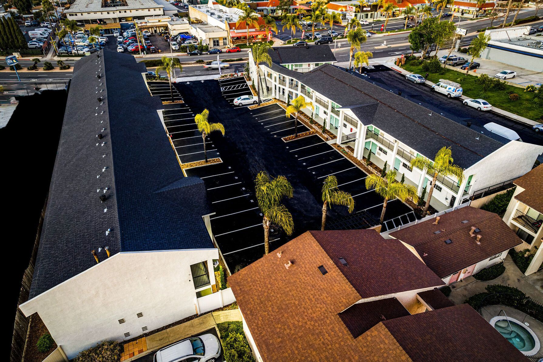Photo of the community, seen from above, showing the parking lot in between two buildings
