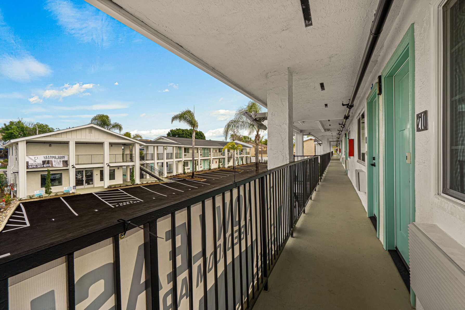 Photo showing the parking lot of the apartment community