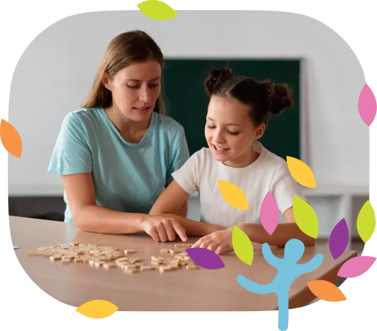 A person and a child sit at a table working on a wooden puzzle, with a decorative border of colorful leaves and a figure.