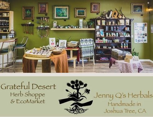 The interior of Grateful Desert Herb Shoppe, an olive-green store with shelves of herbal products and a branded logo.