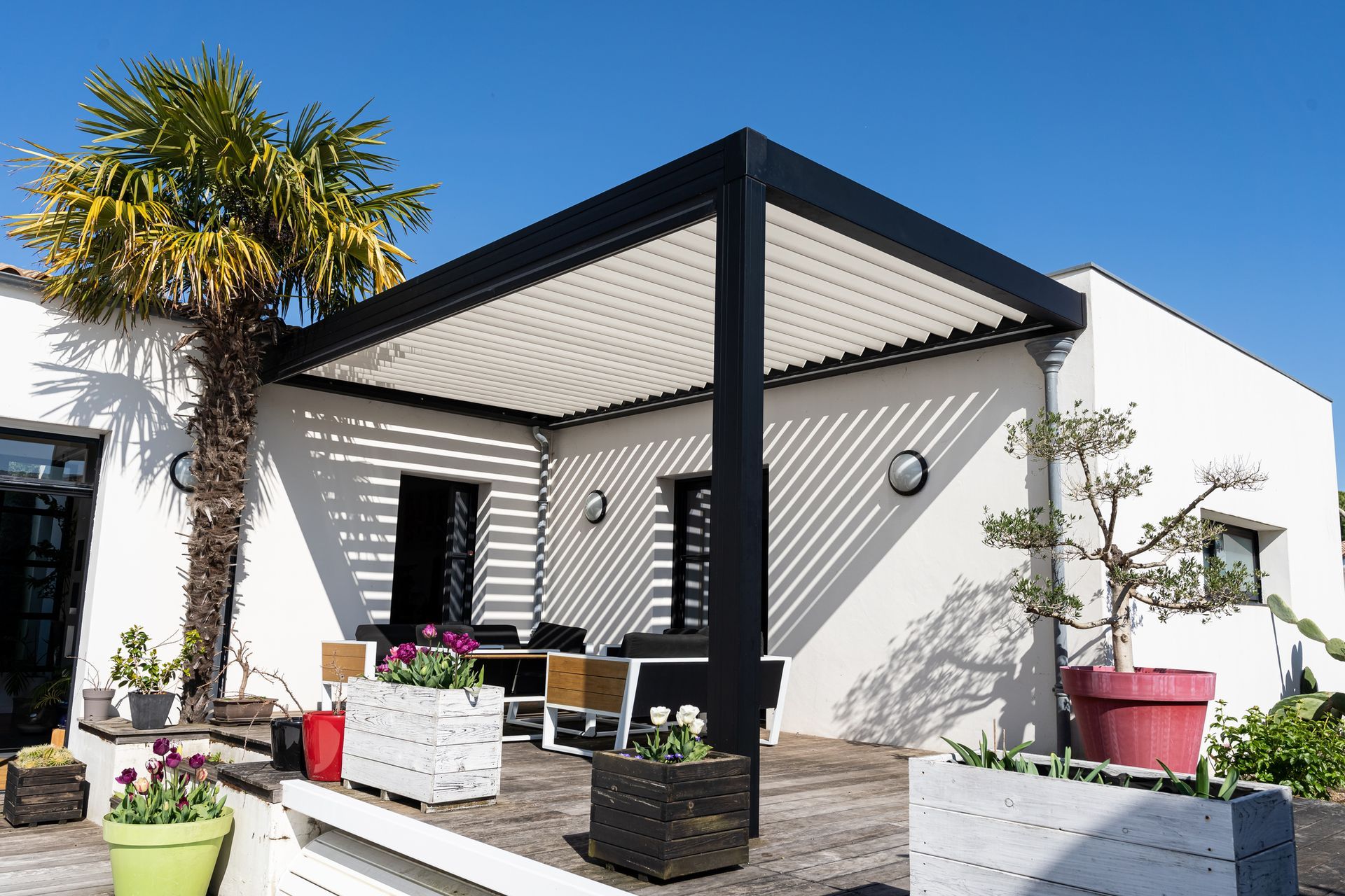 Modern pergola shade structure providing outdoor comfort and UV protection on a residential patio. 