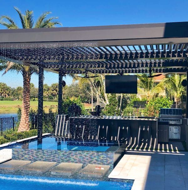 A large swimming pool with a pergola over it