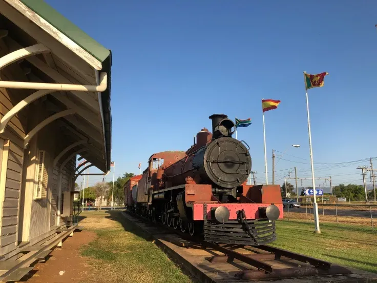 A Truck Is Driving Through a Railroad Crossing with A Sign that Says Keep Tracks Clear — Statix Hair Yeppoon in Blackwater, QLD