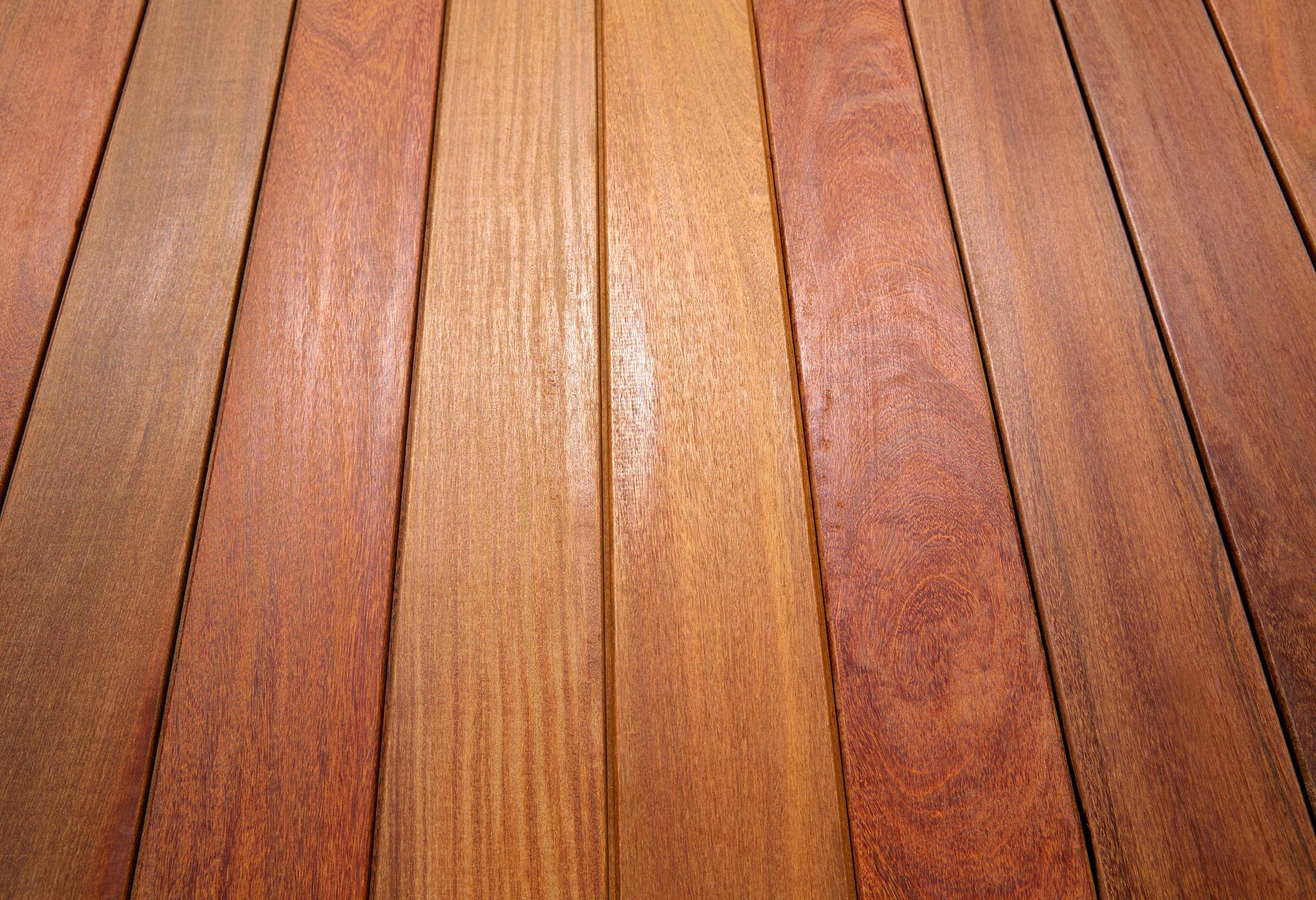 a close up of a wooden deck with a striped pattern .