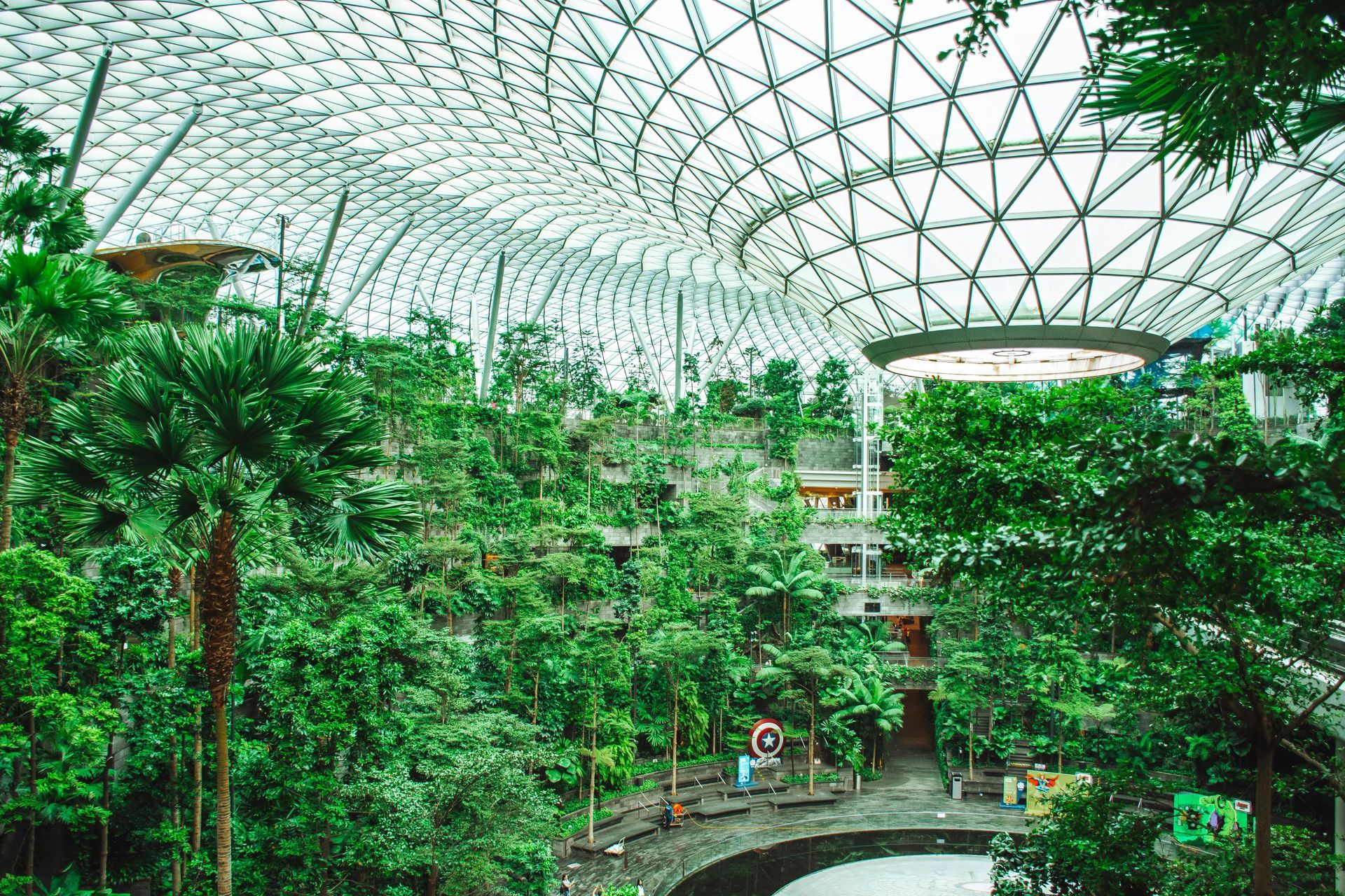 A large building filled with lots of trees and plants.