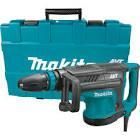 A makita hammer drill is in a blue case.