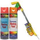 A spray can of survey marking paint with a stick attached to it.