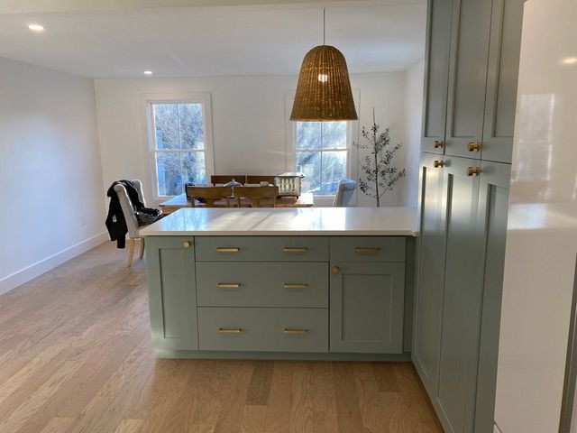 A kitchen with a large island in the middle of the room.