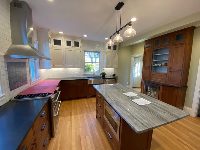 There is a large island in the middle of the kitchen.