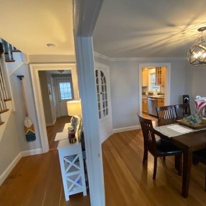 There is a table and chairs in the dining room.