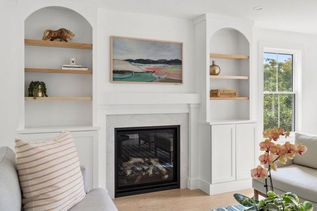 A living room with a fireplace and a couch