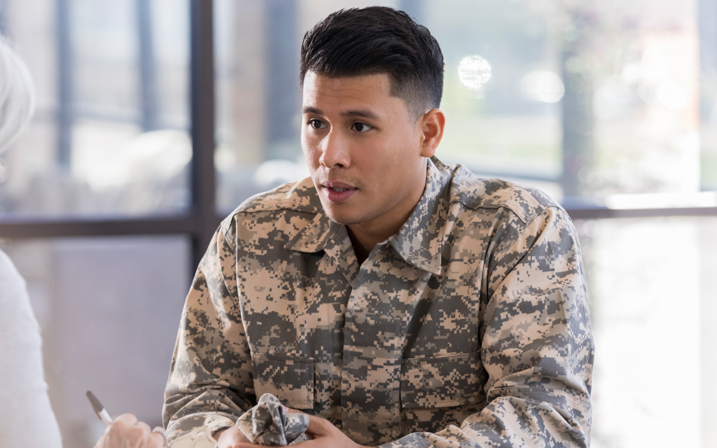 A man is holding the hand of another man