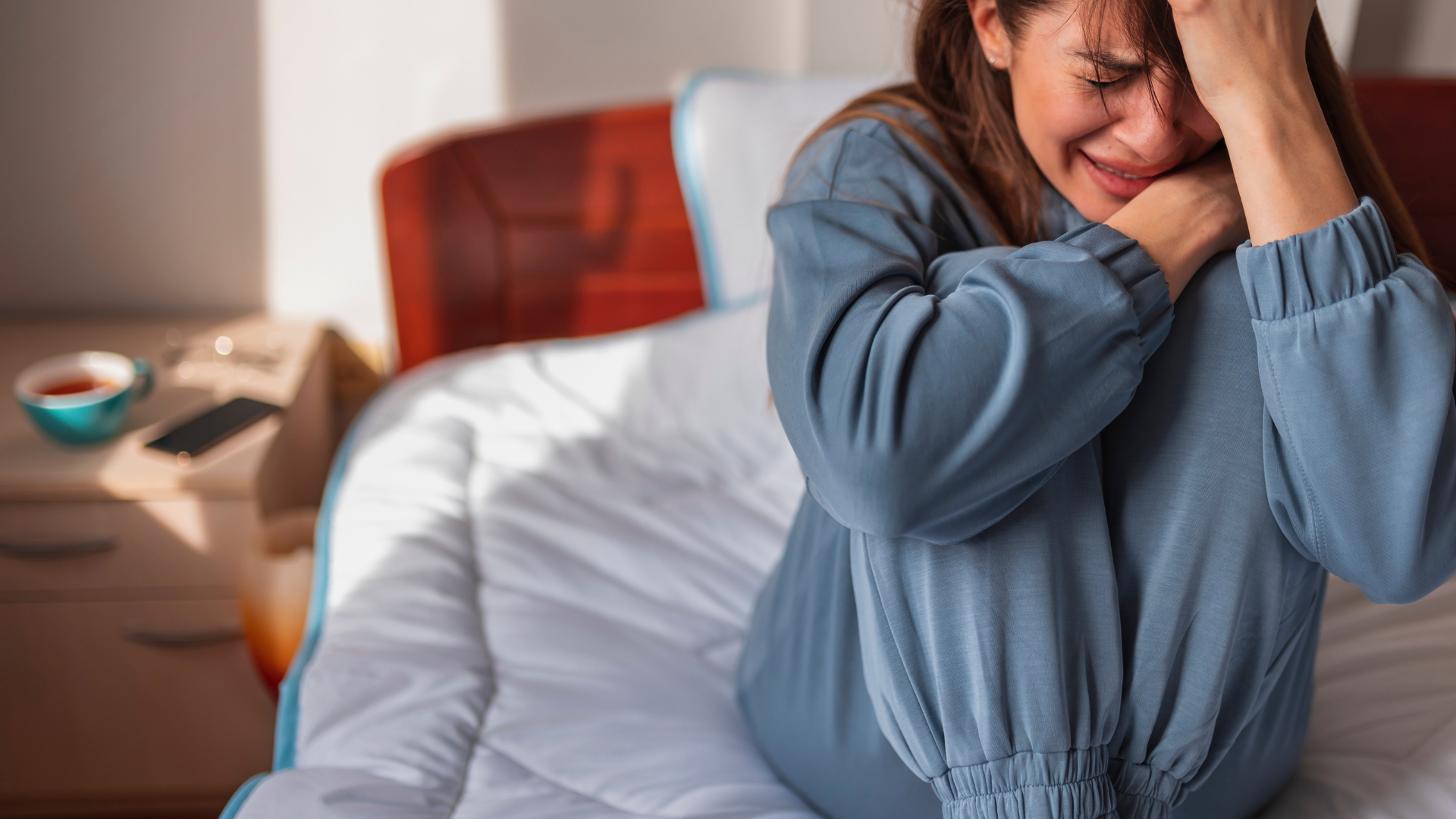A group of people are standing in a circle and smiling at the camera.