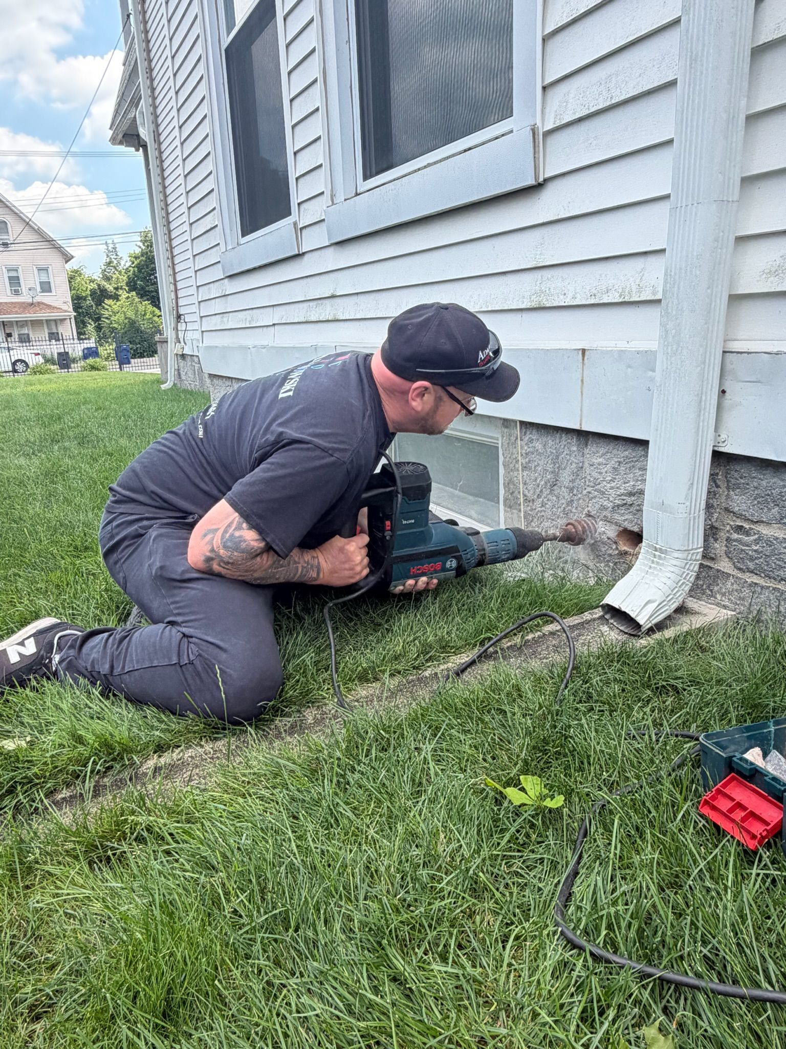 Adamowski Heating and Cooling technician completing oil tank piping work