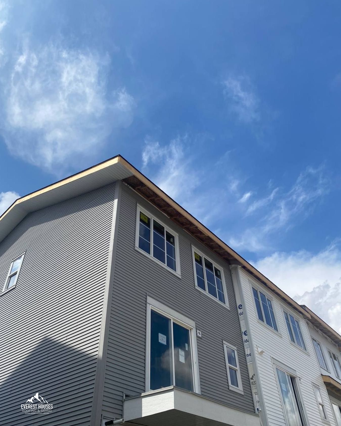 Big Grey And White House Construction — Calgary, AB — Everest Houses Roofing & Siding 