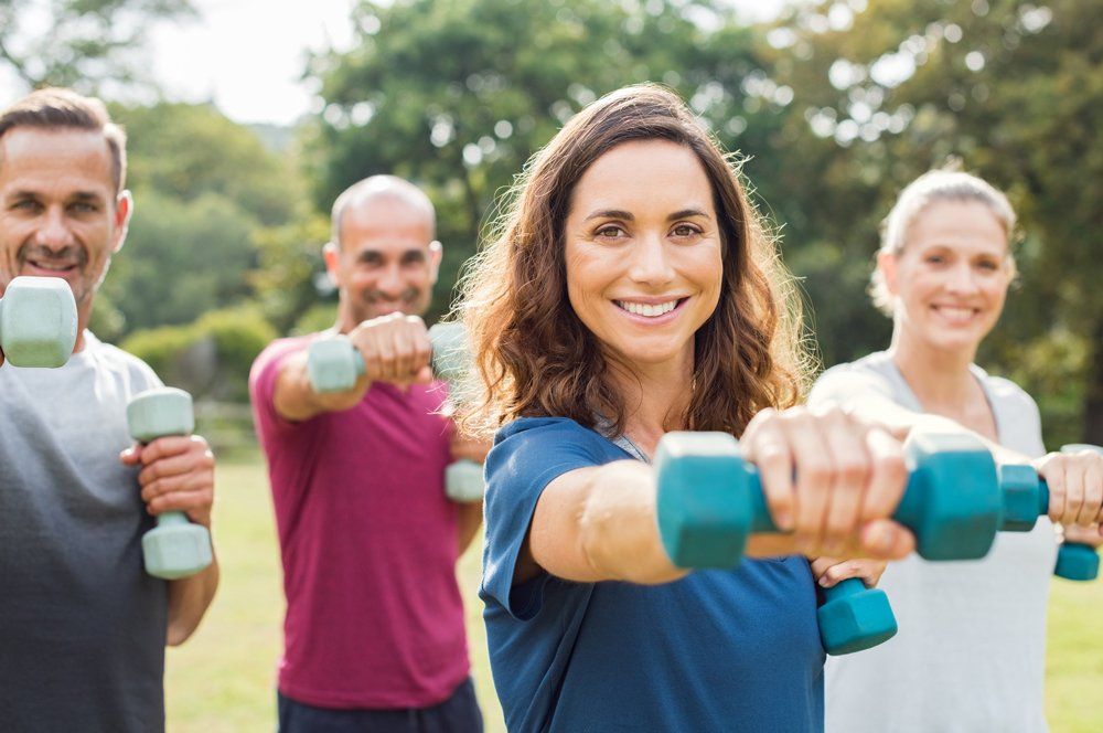 People Using Dumbbells — Greensboro, NC — Merlin Centre For Hypnosis & Enlightenment