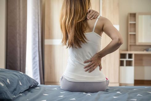 Woman Suffering From Back Ache — Greensboro, N.C — Merlin Centre For Hypnosis & Enlightenment