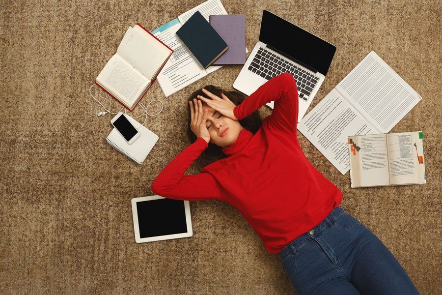 Tired Student Girl Lying on the Floor — Greensboro, N.C — Merlin Centre For Hypnosis & Enlightenment