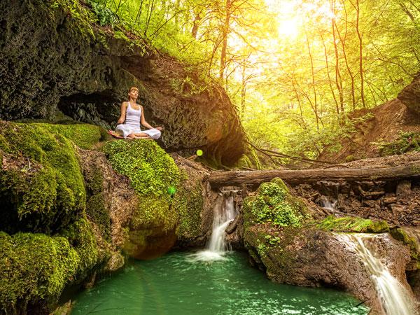 Woman Meditating in Woods — Greensboro, NC — Merlin Centre For Hypnosis & Enlightenment