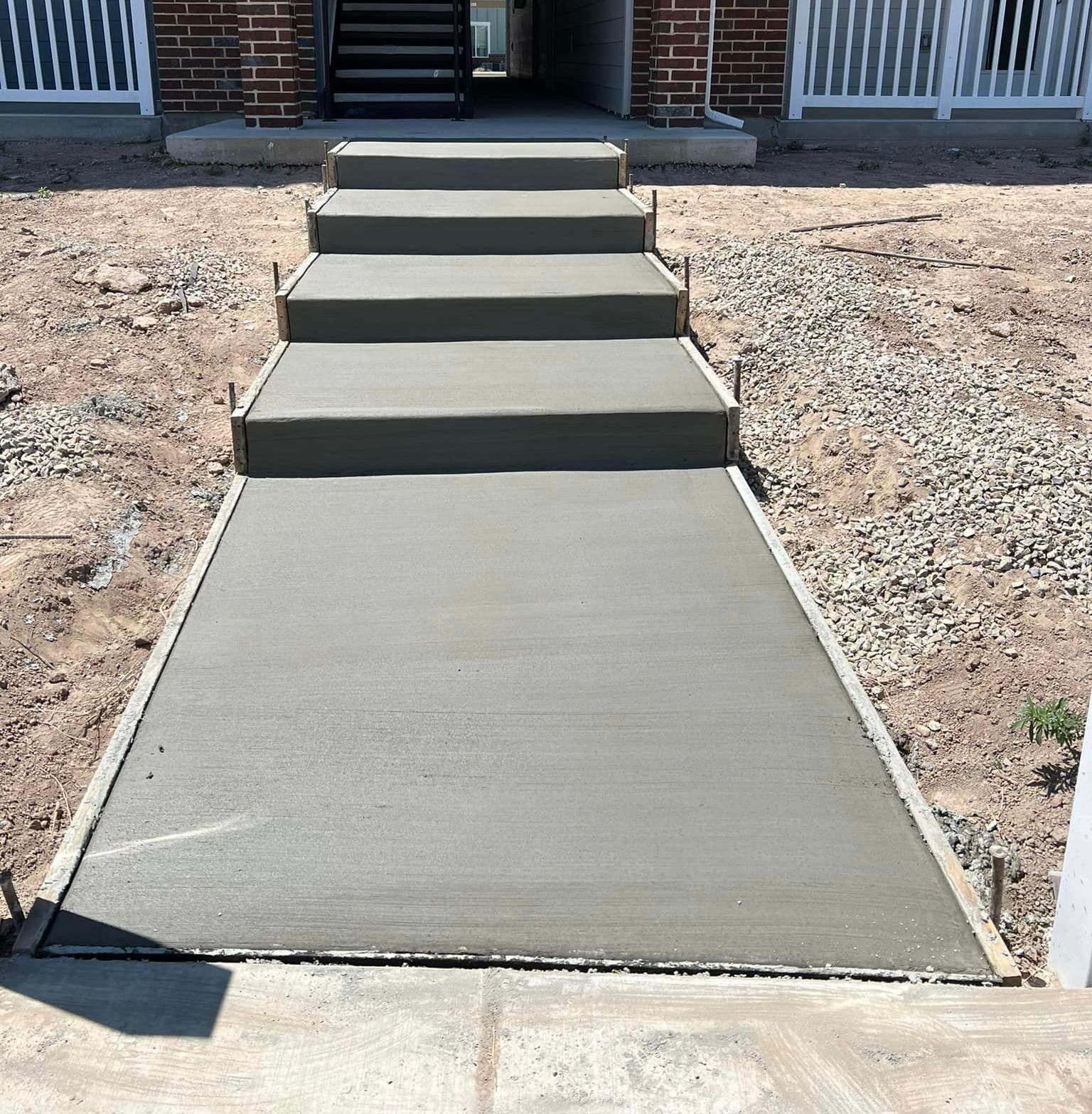 A set of concrete steps leading up to a house