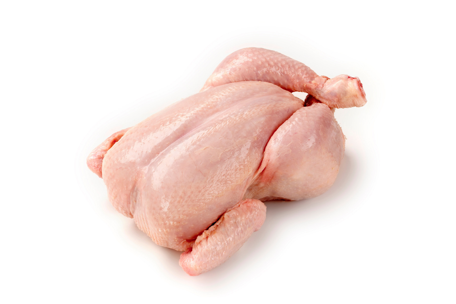 Raw, whole chicken on a white background, ready for cooking.