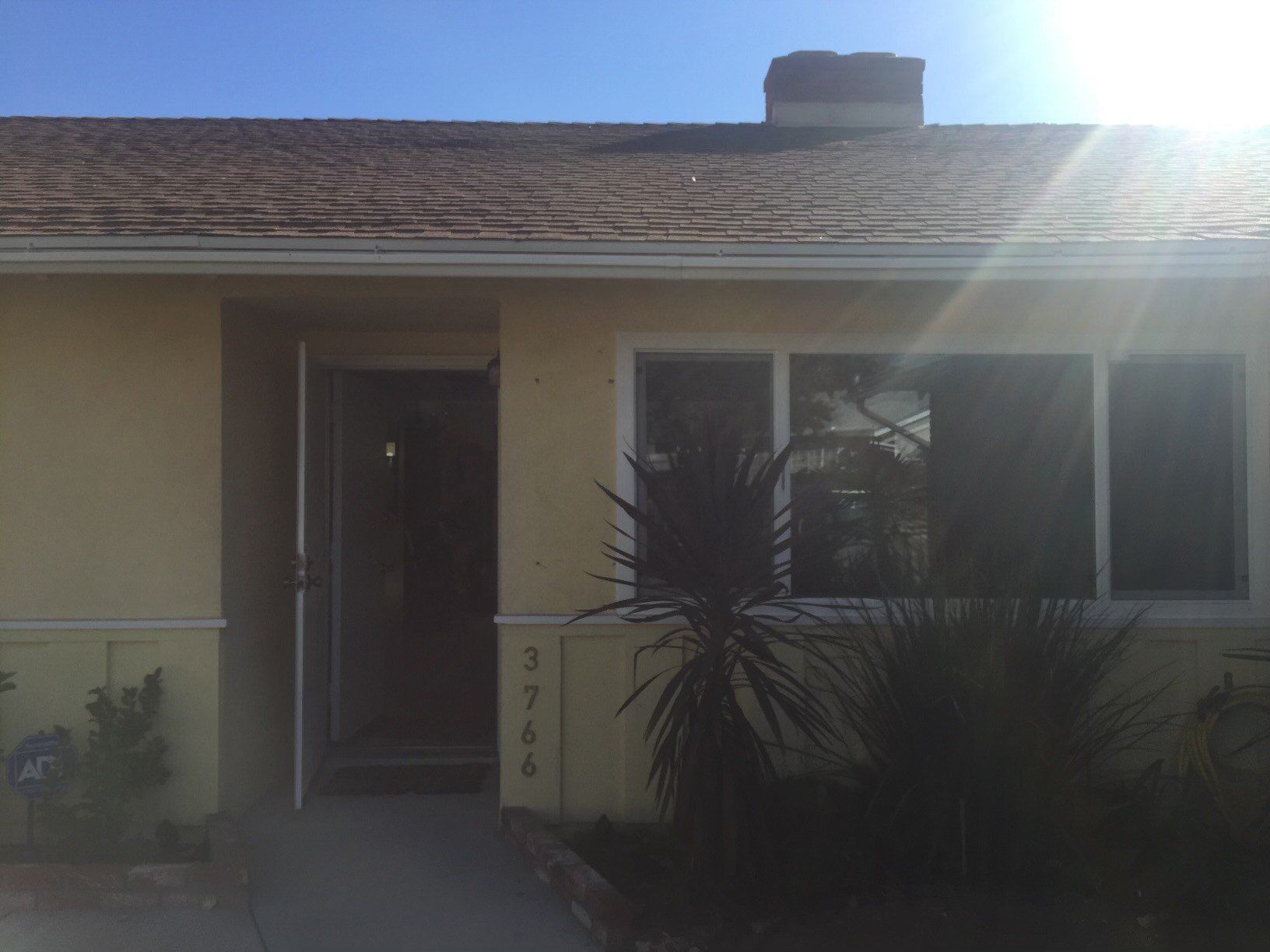 The sun is shining through the windows of a house.