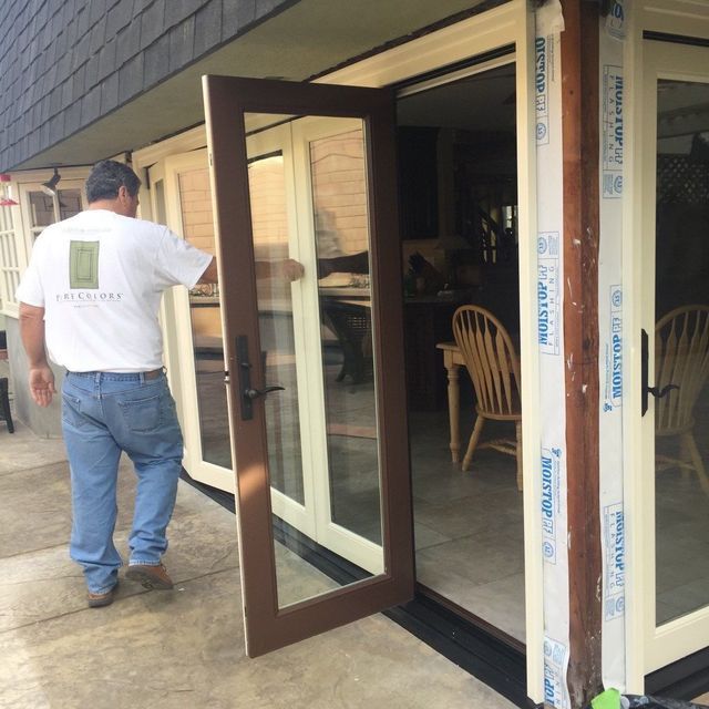 A man standing in front of a door that says prestige on it