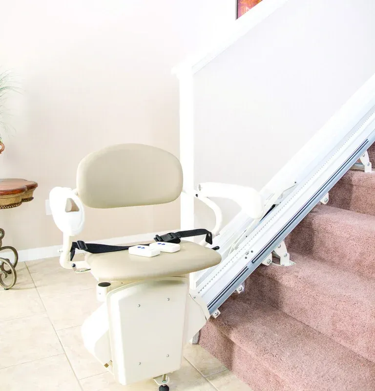 Woman in wheelchair entering through a narrow accessible doorway.