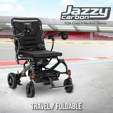 Black travel folding electric wheelchair with joystick control, shown on a racetrack background.