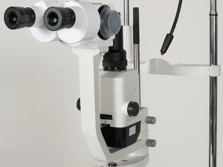 A close up of a microscope with two lenses