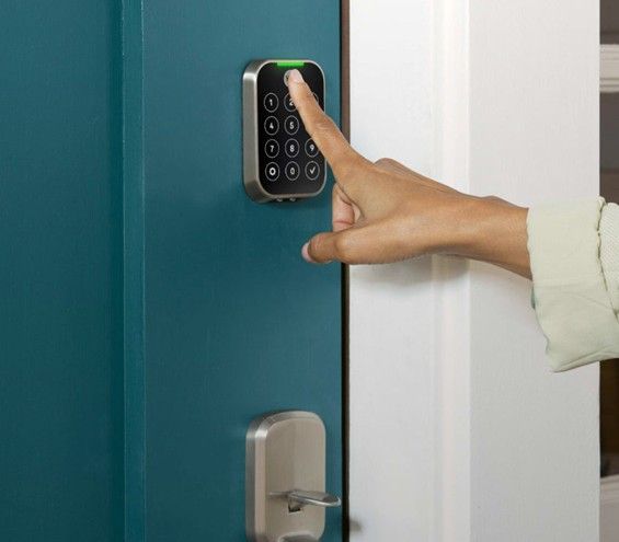 Wireless security alarm with fingerprint scanner and digital keypad control.