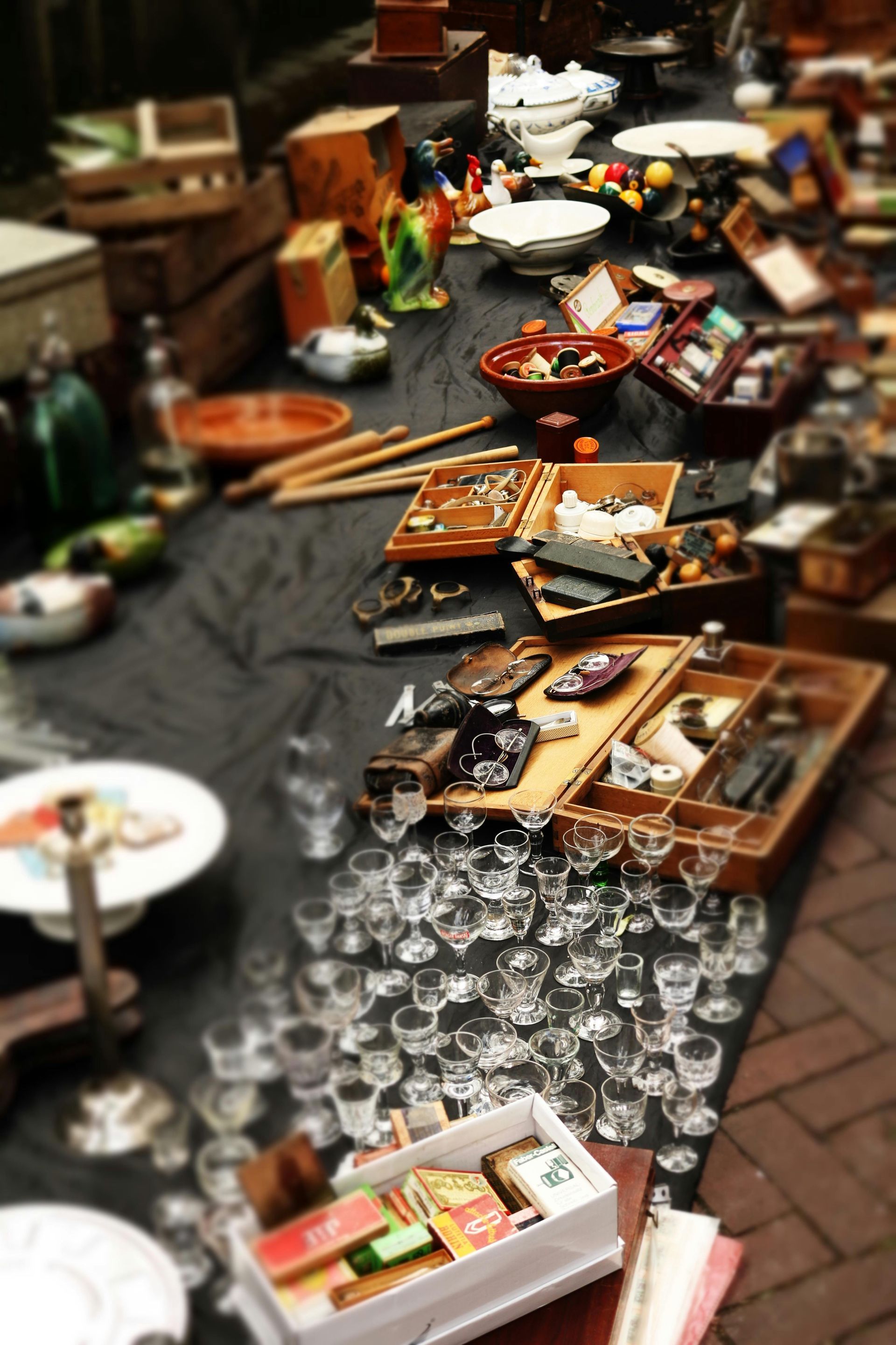 A table with a lot of items on it including glasses and plates