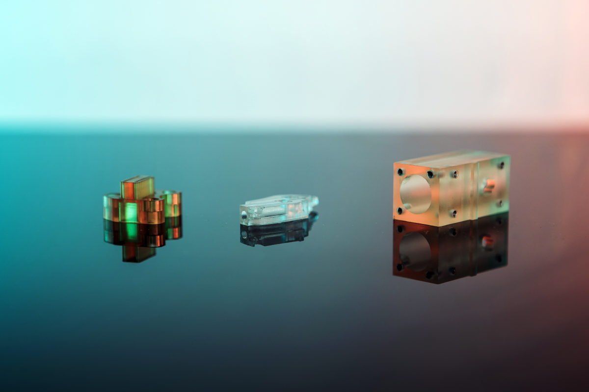 Three blocks are sitting on top of each other on a table.