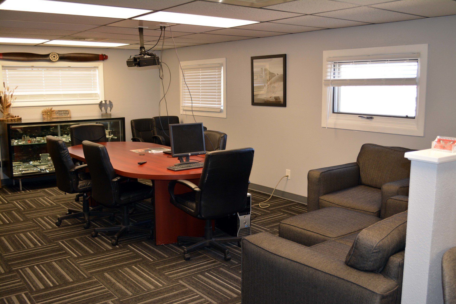 A conference room with a large table and chairs