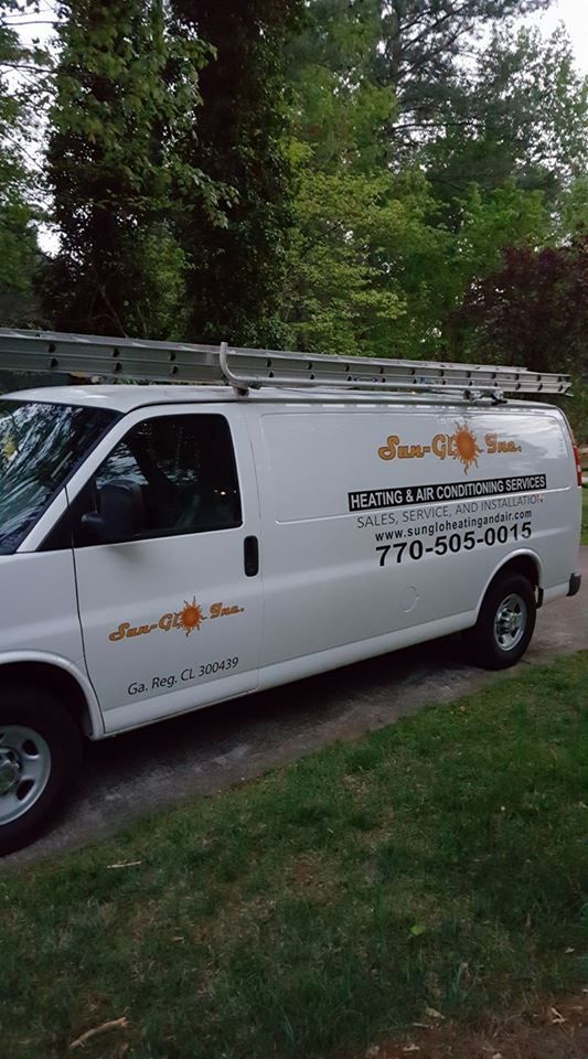 A group of people are standing in the middle of a canyon.