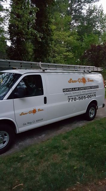 A group of people are standing in the middle of a canyon.