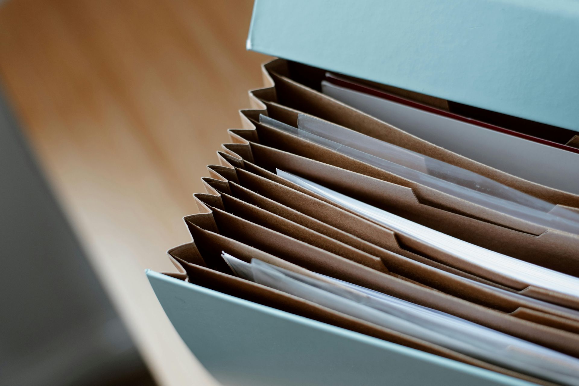 Open file folder with stacked papers in a close-up view