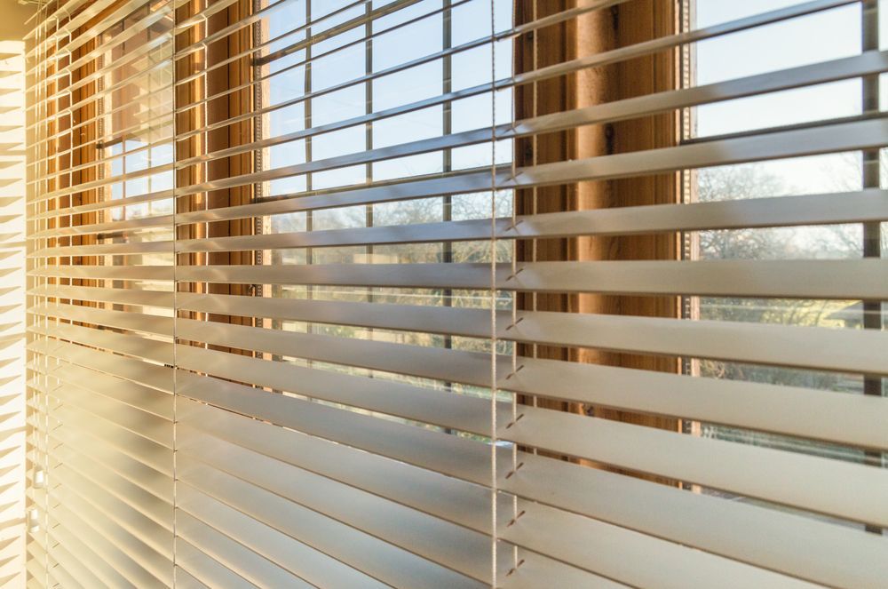 A close up of a window with blinds on it — Curtain Force NQ in Garbutt, QLD