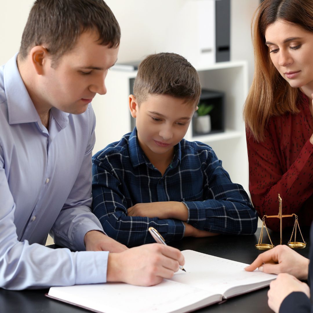 parents looking over papers with their child