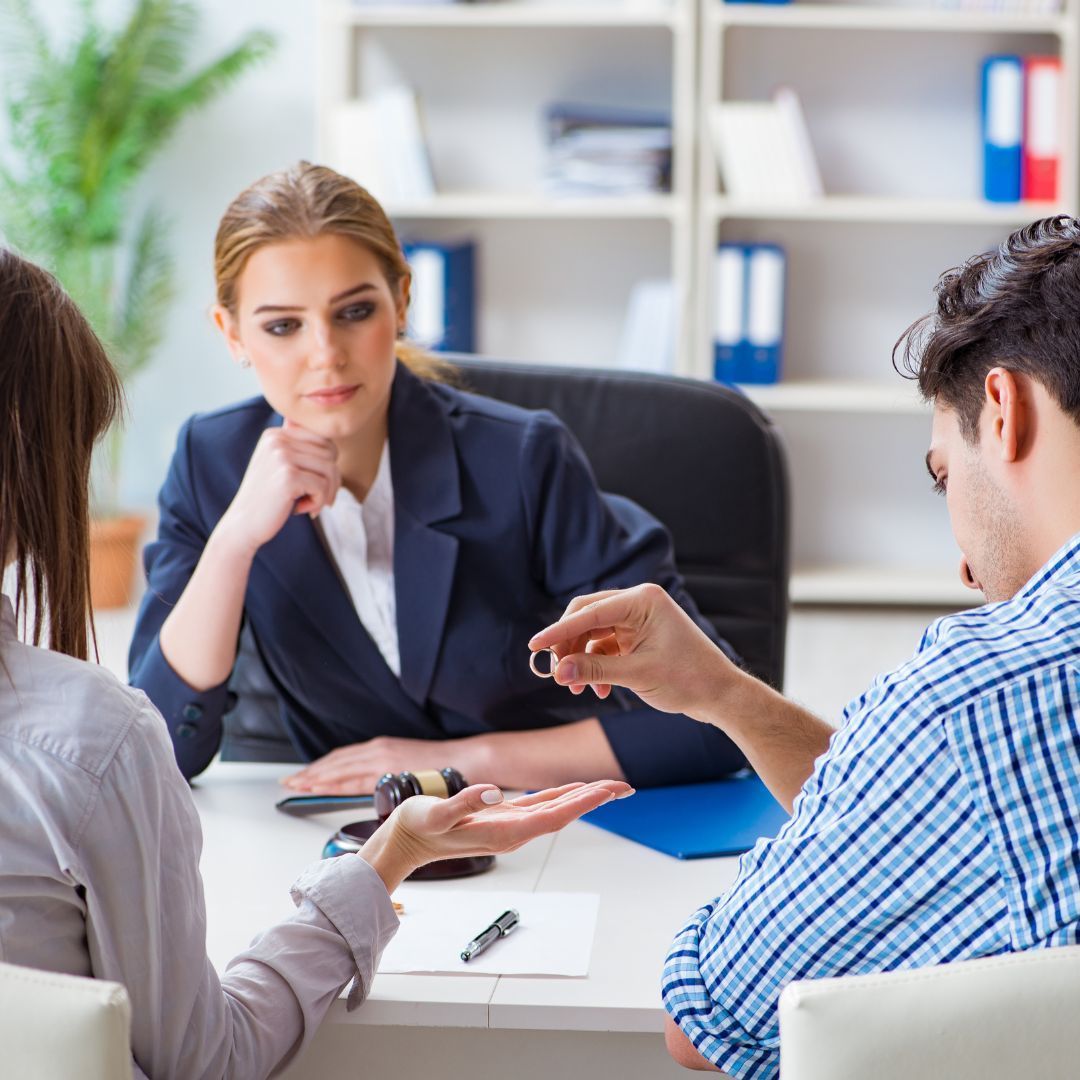 couple talking to divorce lawyer