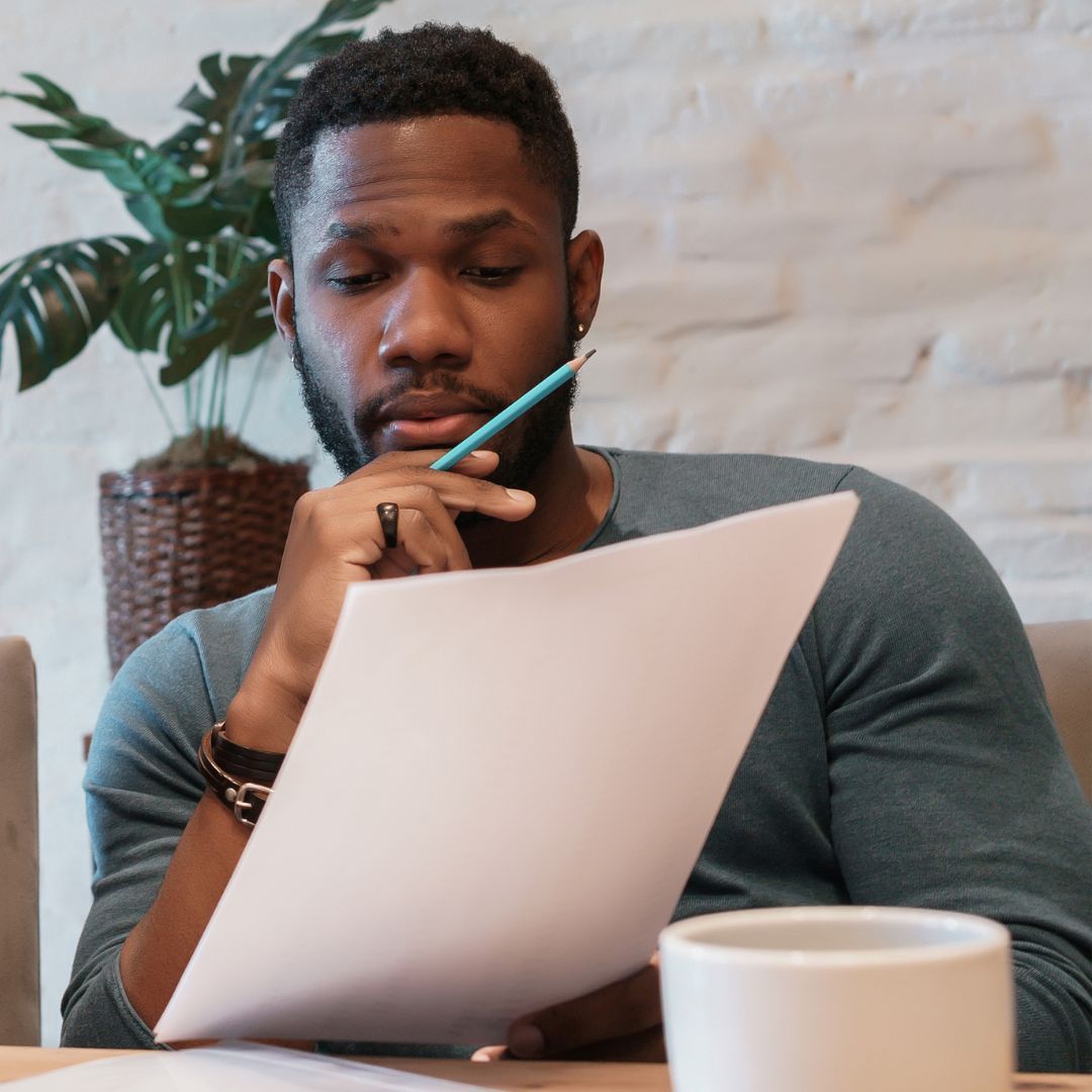 a man looking at paperwork