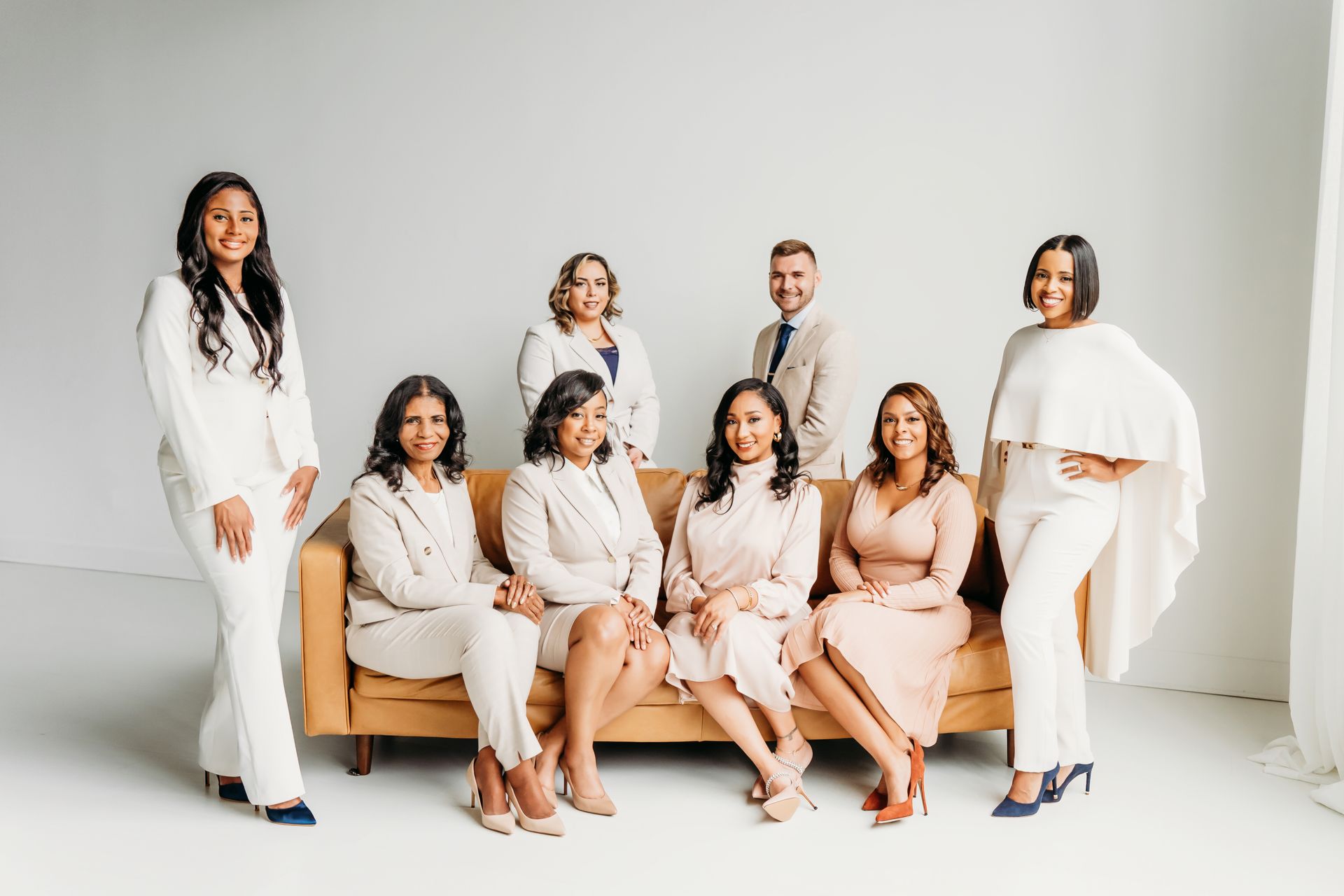 team photo of the firm sitting on a couch