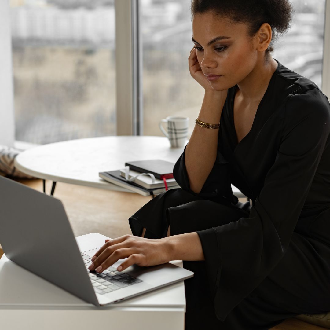 a woman using a laptop