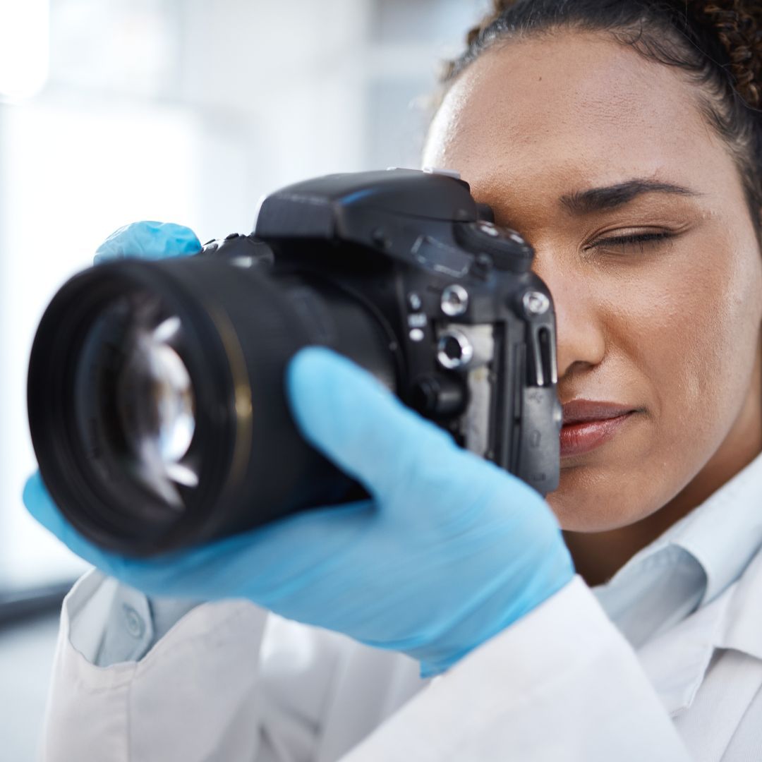 woman collecting medical evidence with camera