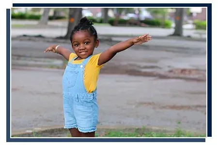 Young girl playing outside